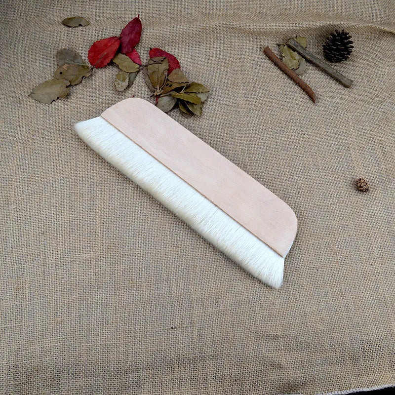Wool fibre art brush for mounting paste and shading in picture colour.