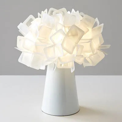 Nordic style bedside table lamp with metal holder in black, showing warm, white, and neutral light settings.