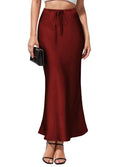Women's high-waist asymmetric satin skirt in black with irregular stitching detail on the hem.