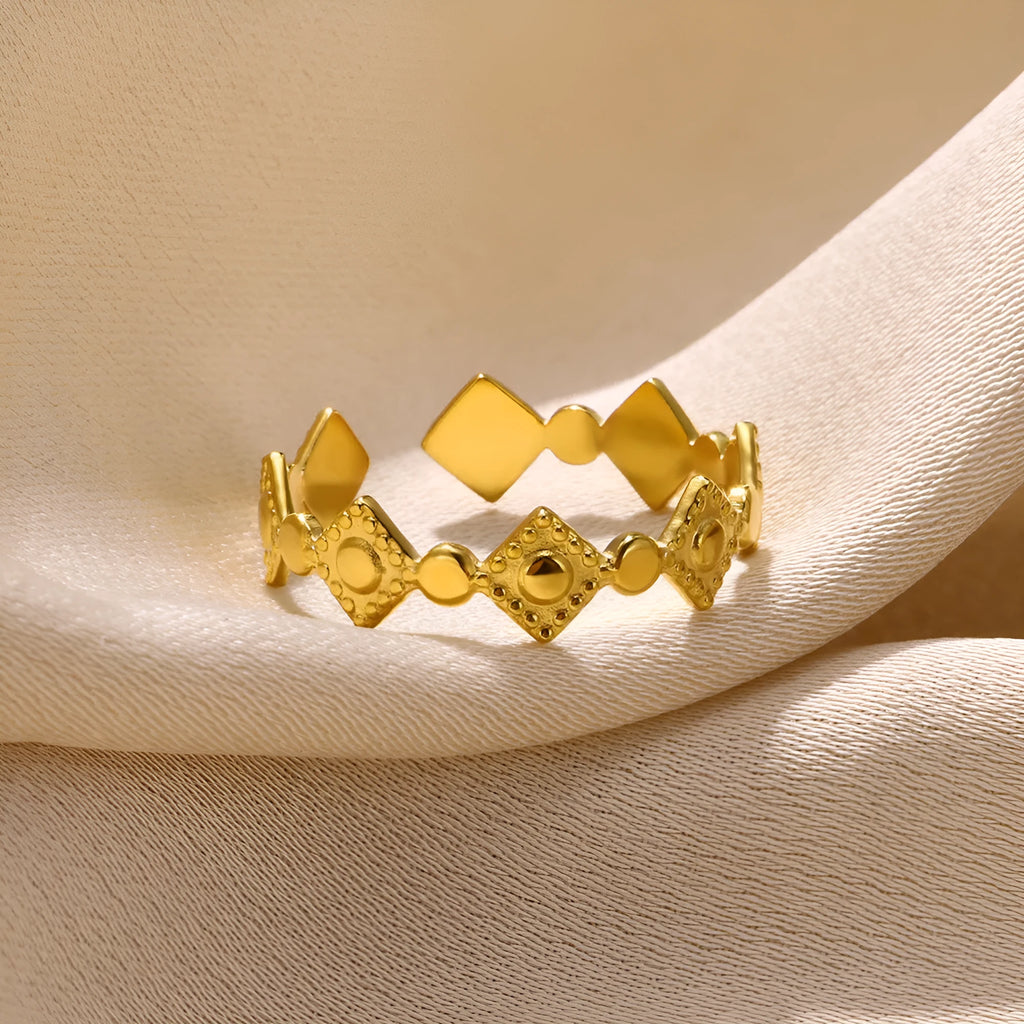 Golden diamond geometric titanium steel women's ring on display
