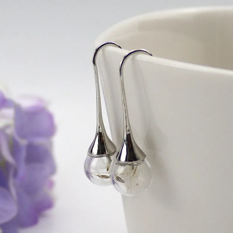 Transparent crystal dandelion seed glass ball earrings on French hook in silver and bronze finishes