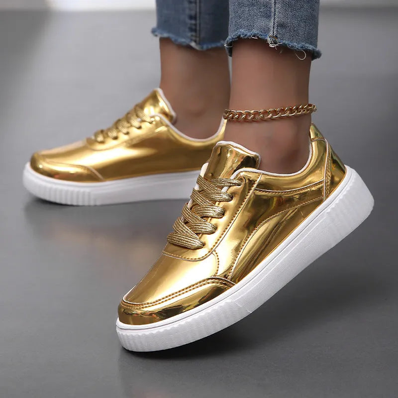 Rose gold platform sneaker with sequin details and a thick, light-coloured sole.