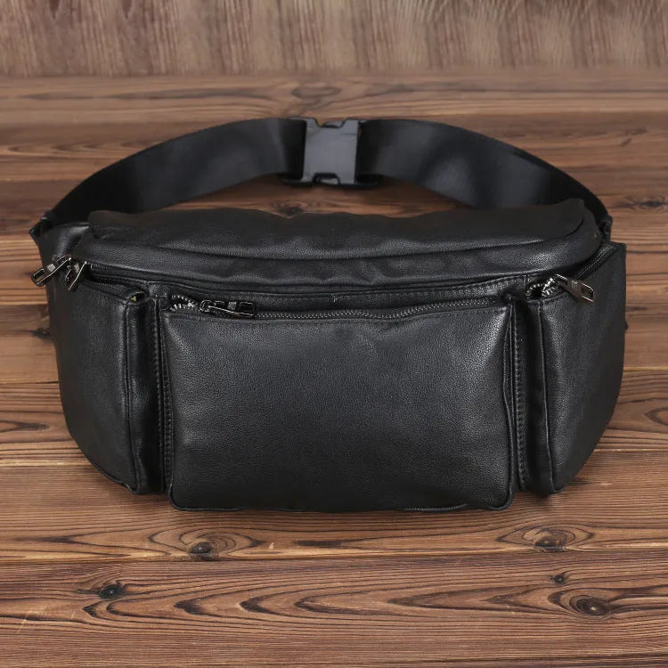 Black cowhide leather messenger bag with large capacity, oval shape, and zipper closure – worn over the shoulder as a crossbody bag