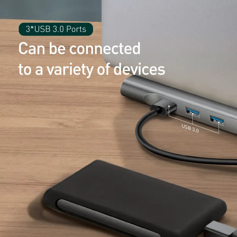 Grey aluminium laptop docking station with cooling bracket and ten ports including HDMI, VGA, and Ethernet.