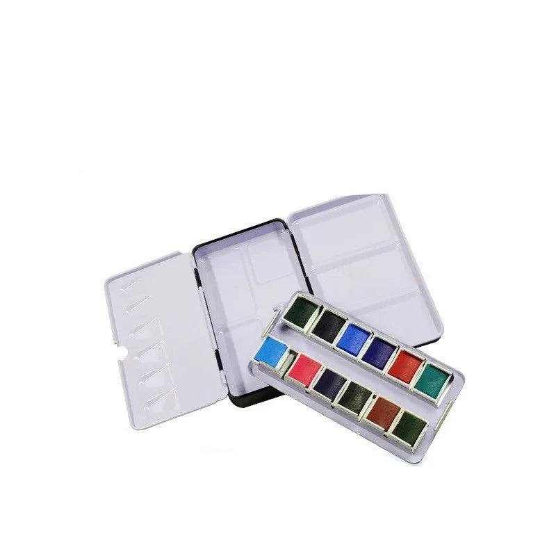 Empty square tinplate paint box for solid watercolours with folded compartments.