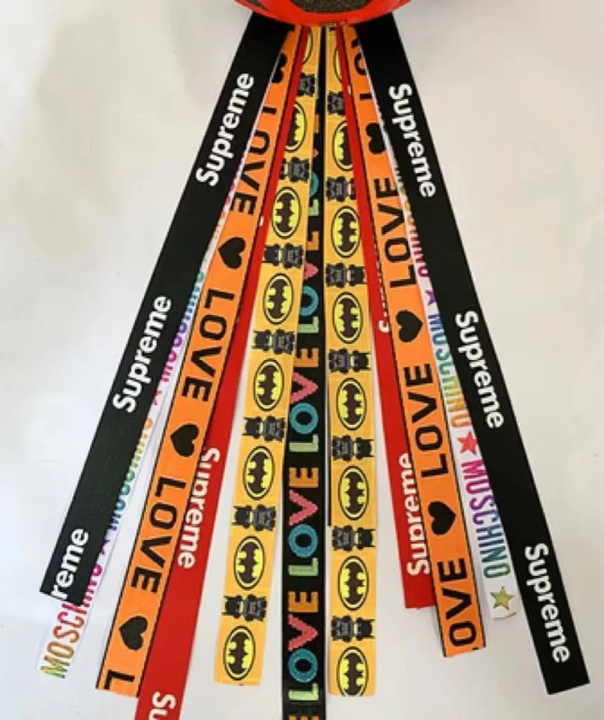 Colourful decorative ribbon streamers attached to a children safety helmet for skating or skiing