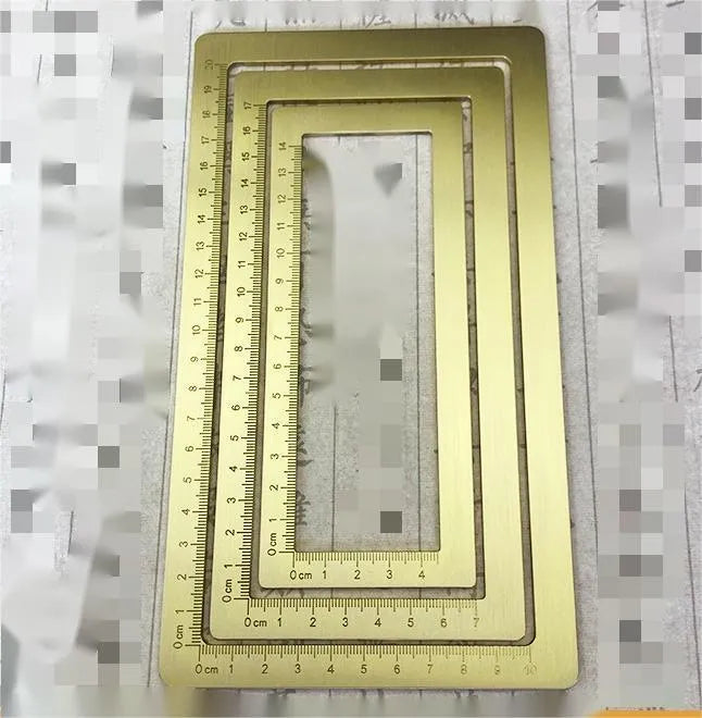 Solid brass paper weight set with engraved square design for calligraphy and writing.