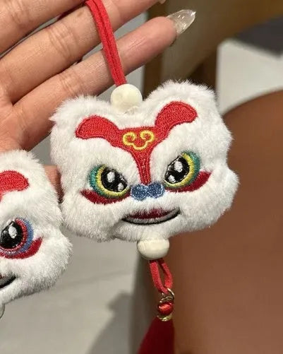 Chinese style blue plush lion keychain ornament with star stone detail and cartoon styling