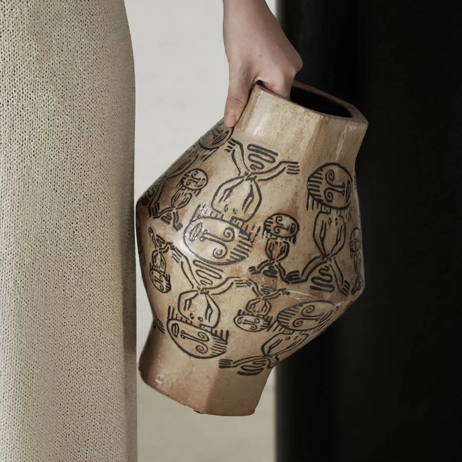 Hand-painted ceramic cylindrical vase with tribal totem patterns in vintage carved style