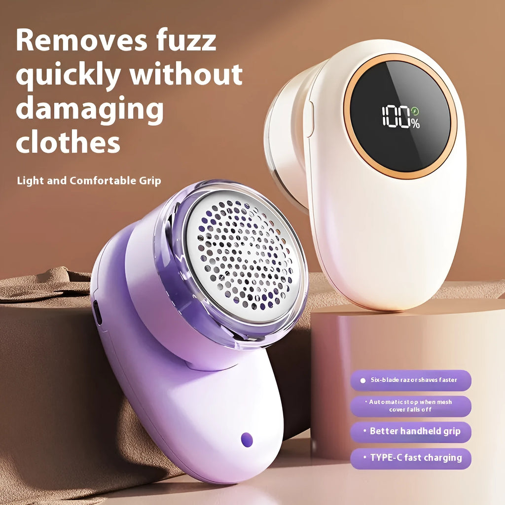 Beige and purple digital fur ball trimmer devices with removable cutter heads on a fabric background