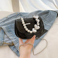 Women's black PU mini tote crossbody bag with phone pocket and single shoulder strap