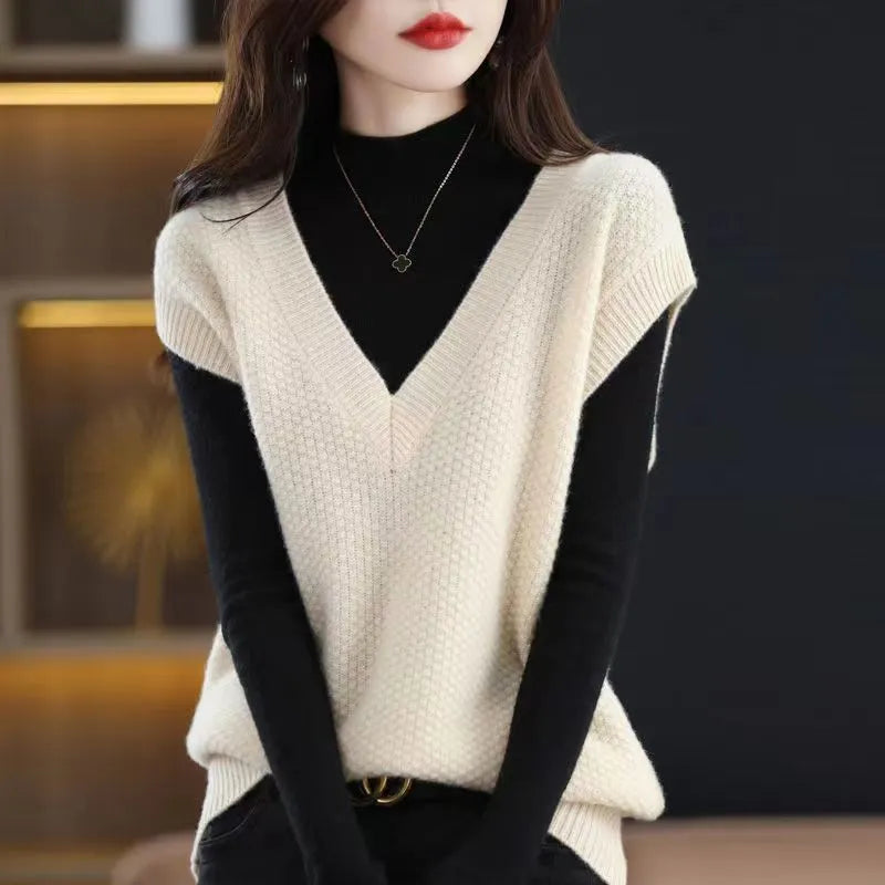 Sleeveless V-neck pullover vest with a textured 3D knit pattern in acrylic fabric, shown in multiple colours.