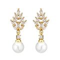 Geometric shaped floral earrings with micro zircon inlays, shown in a gold-tone plated finish.