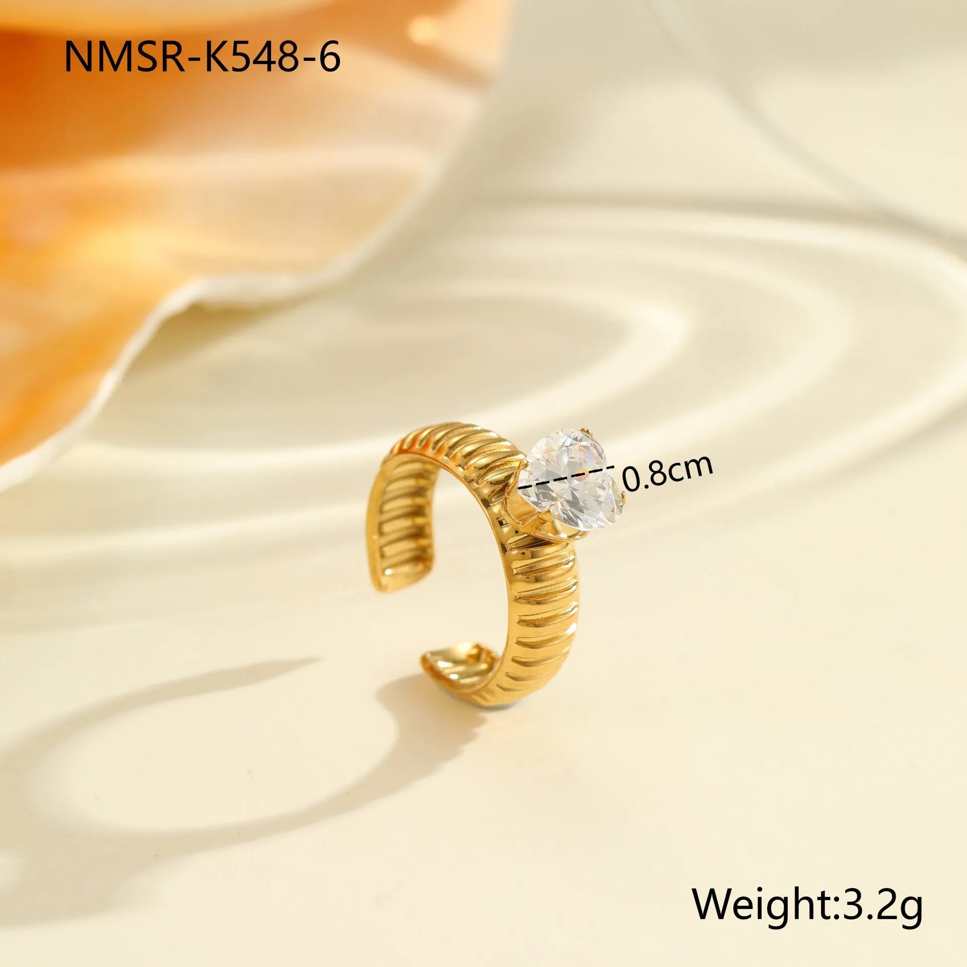 Stainless steel women's ring with gold electroplating and zircon details in geometry design