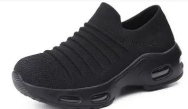 Women's stretch knitted sock shoes in various colours showing mesh upper and round toe design.