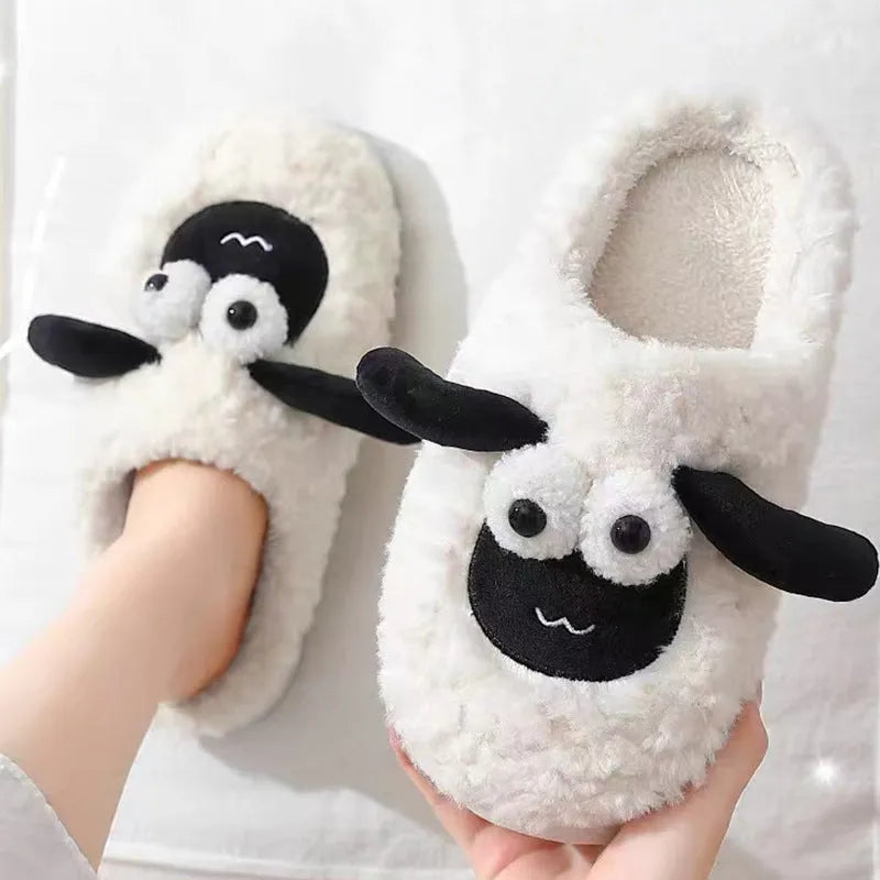 Brown thermal cotton slip-on slippers with suede upper and textured PVC sole on a wooden floor.
