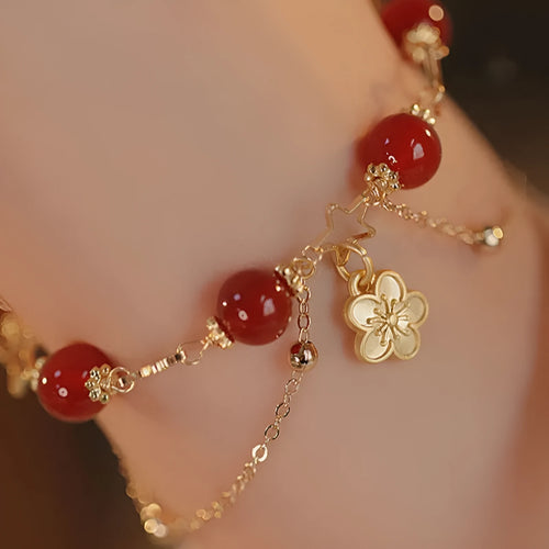Red agate double layer bracelet with peach blossom charm and manual craftsmanship details