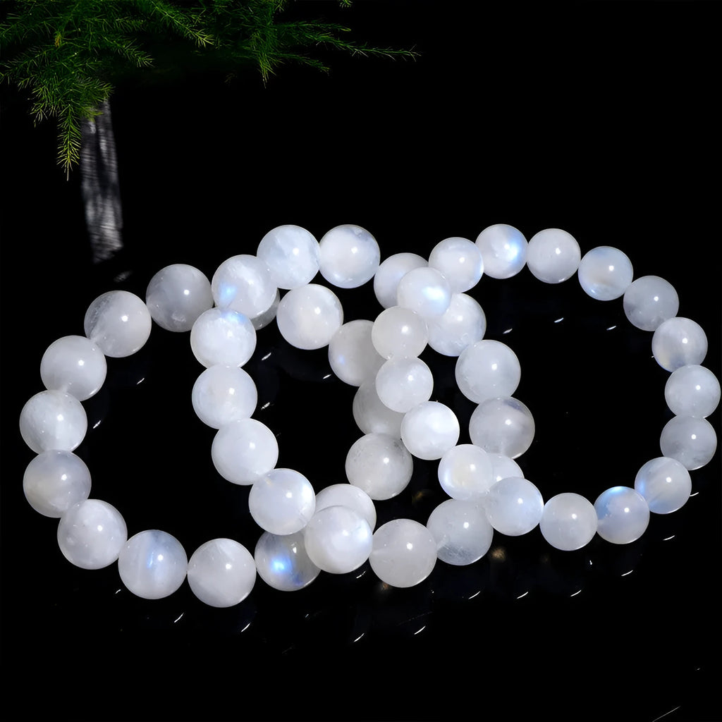 Natural blue moonstone bracelet with polished round beads showing sizing from 5mm to 12mm diameter