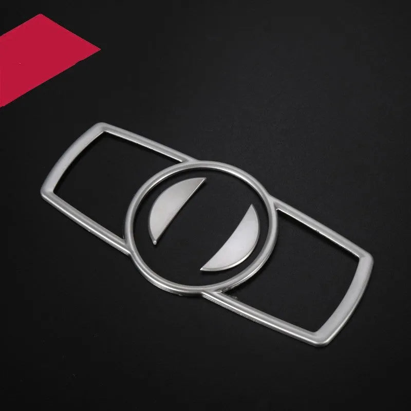 Silver ABS plastic decorative sticker for BMW headlight switch frame interior trim.