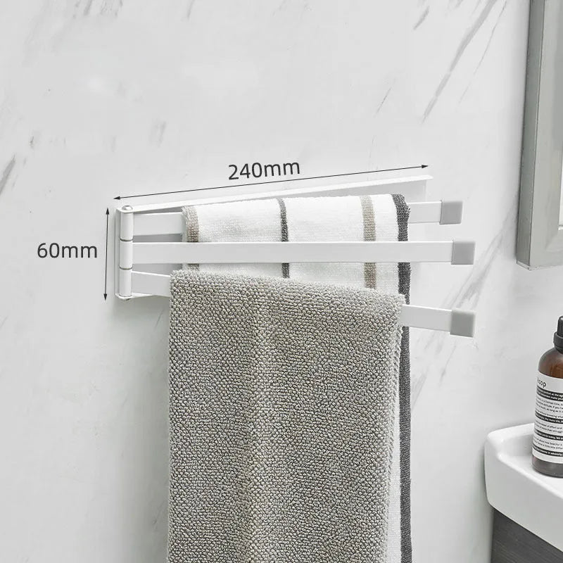 Nordic folding towel bar in black mounted on bathroom wall with towels hanging
