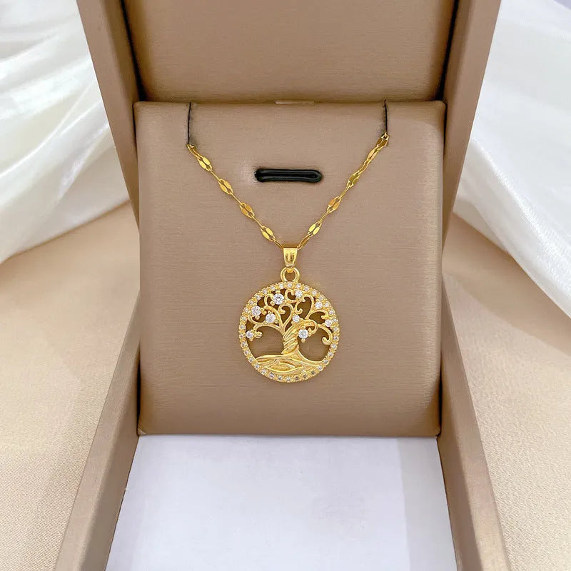 Gold-plated necklace with mother of pearl lucky tree pendant and rhinestone zircons on an adjustable chain.