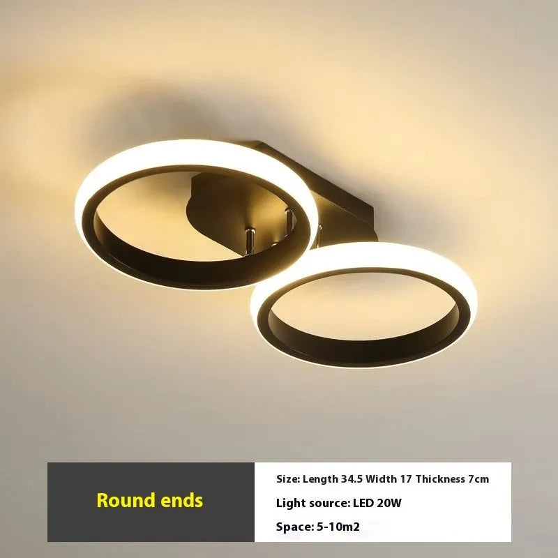 Modern simplicity hallway LED ceiling light in black with three round shapes over a corridor