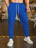 Man wearing grey lightweight linen-style casual trousers with an elastic drawstring waistband.