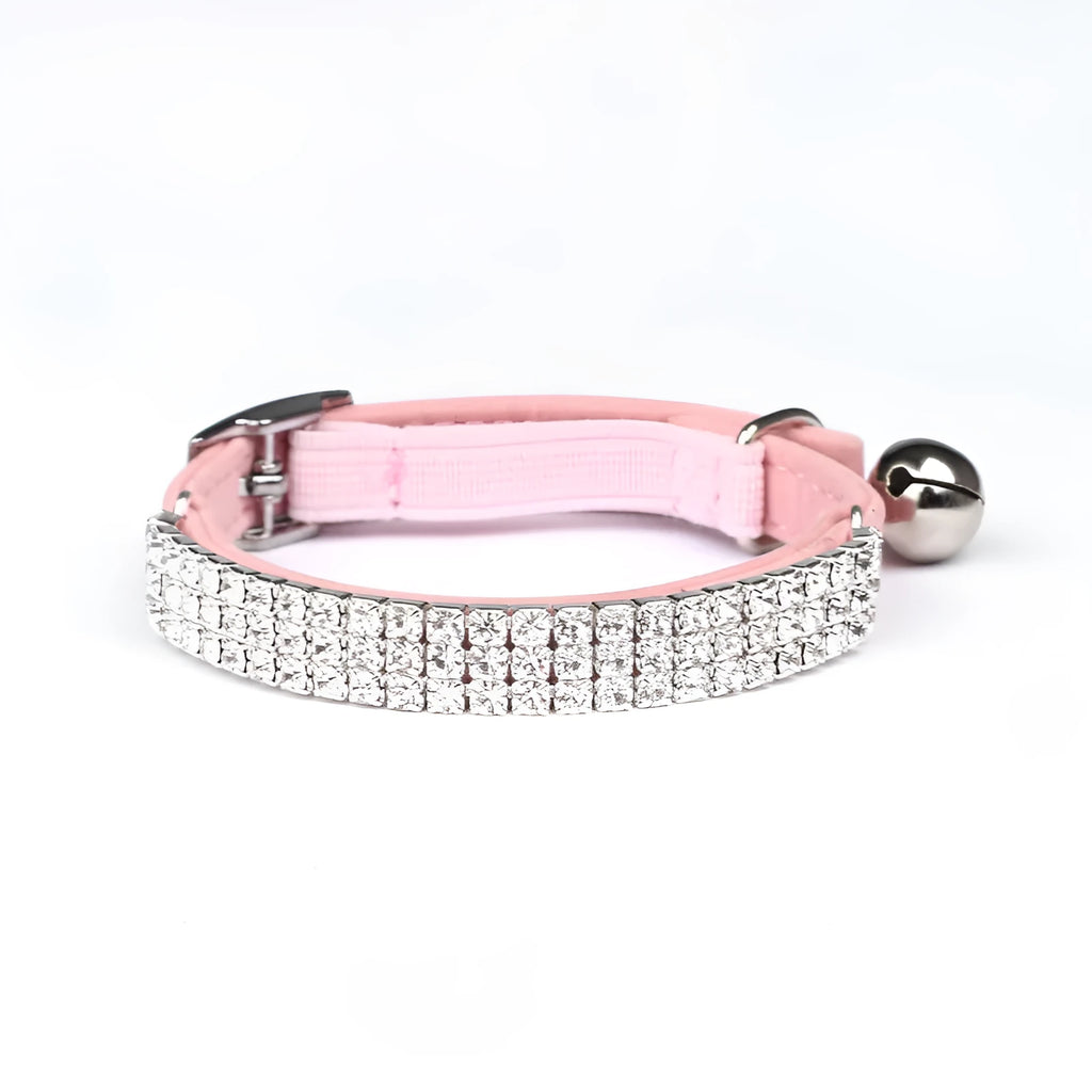Soft red velvet cat collar with rhinestones, shown adjusted to fit.