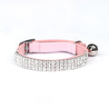 Soft red velvet cat collar with rhinestones, shown adjusted to fit.