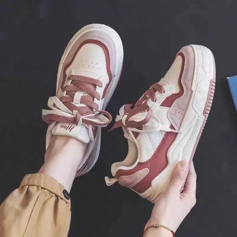 Women's beige and pink low-top rubber sneakers with height-increasing sole on a white background
