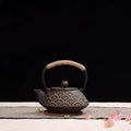 Japanese cast iron teapot with traditional patterns and 0.9L capacity