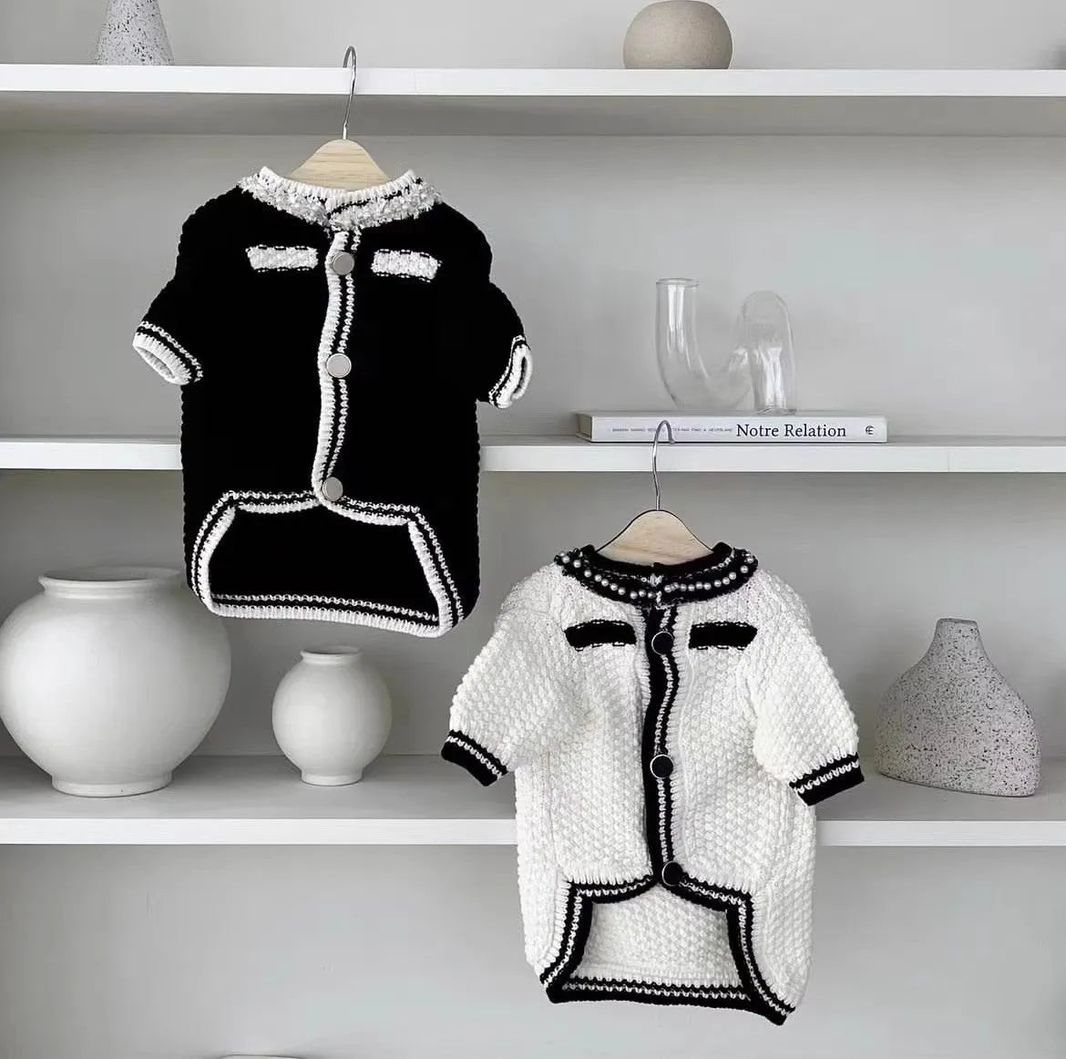 White Korean style dog sweater with pearl collar on small dog, showing princess cut and decorative details