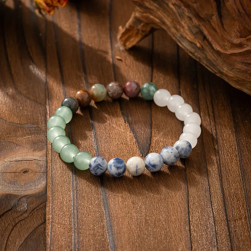 Vintage bohemian style natural stone bead necklace and bracelet set showing geometric round beads and tassel detailing