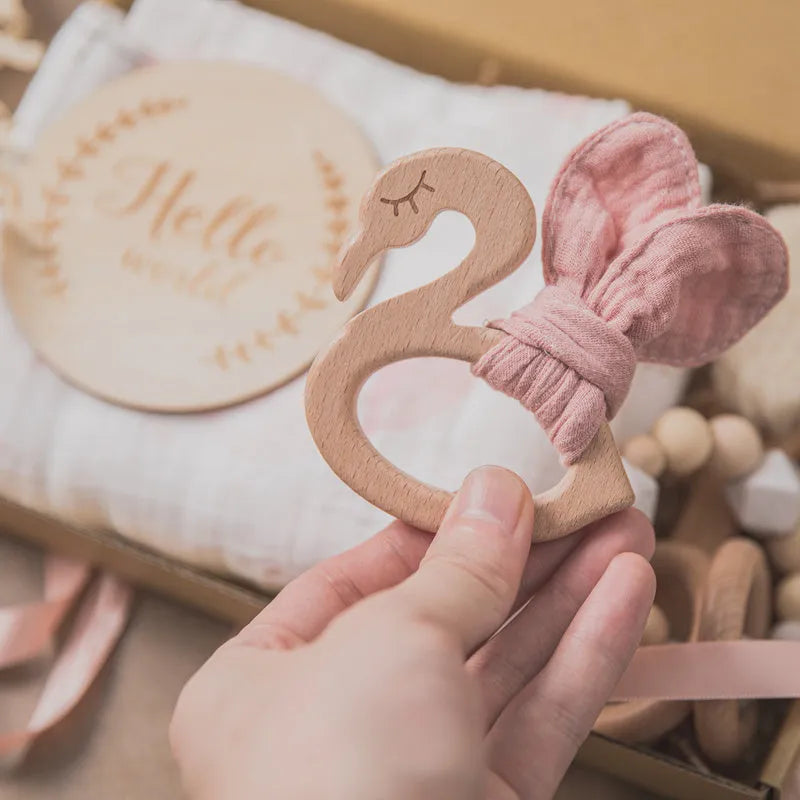 Newborn baby shower toy set of six bath toys in wood and chemical fibre, available in blue, brown, or peach