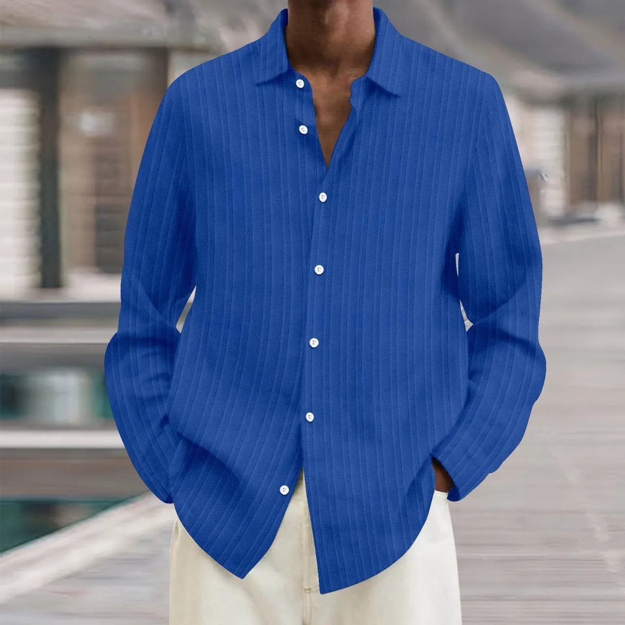 Man wearing a loose fit striped cardigan shirt in British style with a 3D pattern.