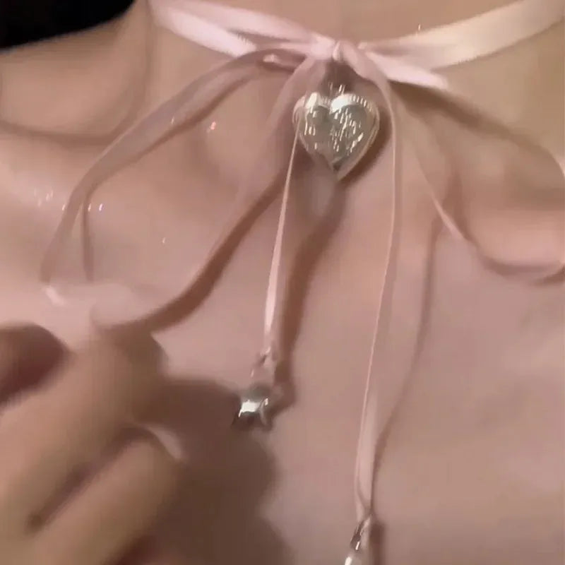 Women's love pendant necklace with ribbon detailing on alloy clavicle chain