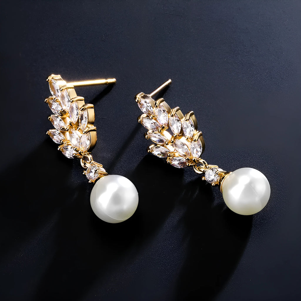 Geometric shaped floral earrings with micro zircon inlays, shown in a gold-tone plated finish.