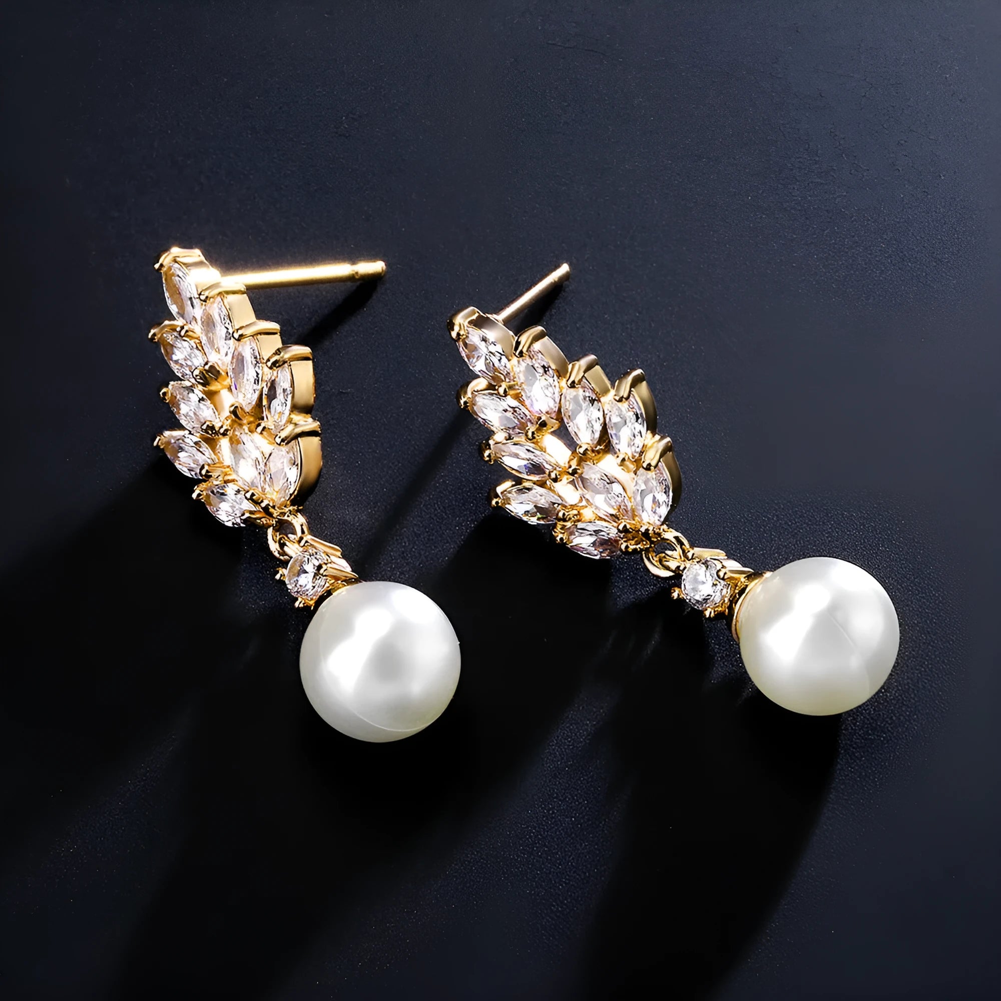 Geometric shaped floral earrings with micro zircon inlays, shown in a gold-tone plated finish.