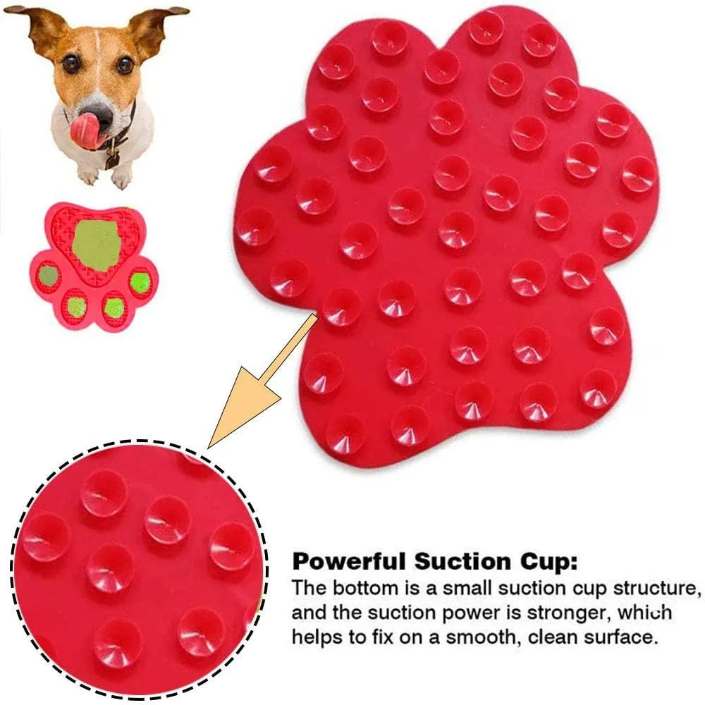 Blue bone-textured silicone dog licking mat with suction cups on back, shown on a tiled wall.