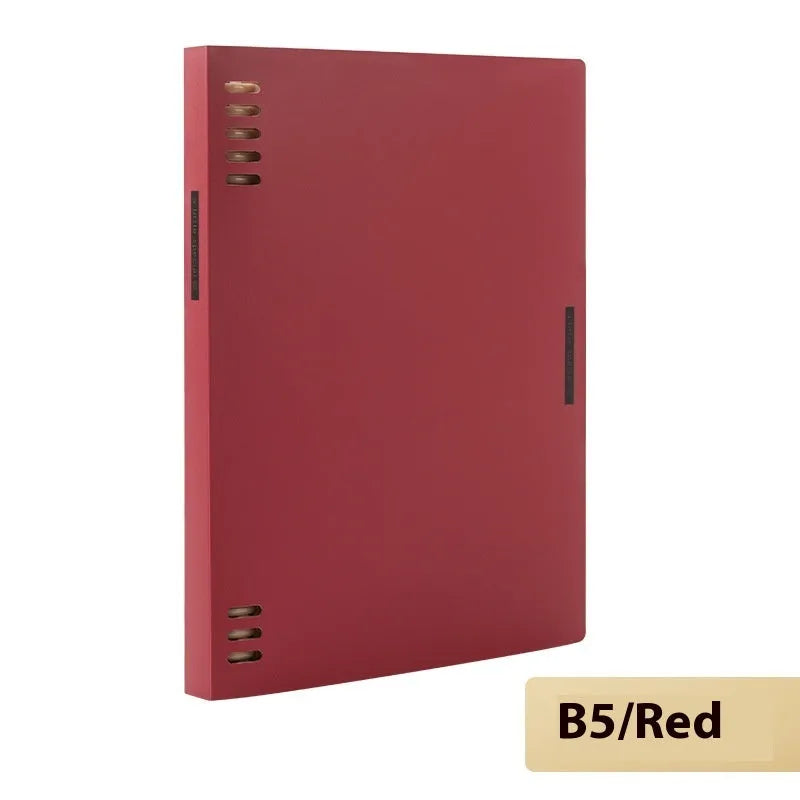 Loose-leaf spiral notebook with PP cover open, showing raw wood pulp pages in A5 or B5 size.