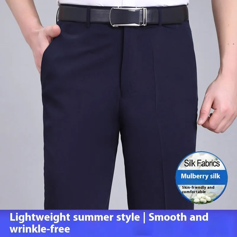 Man wearing dark blue straight-leg suit pants with a high waist, made from a non-ironing mulberry silk blend fabric.
