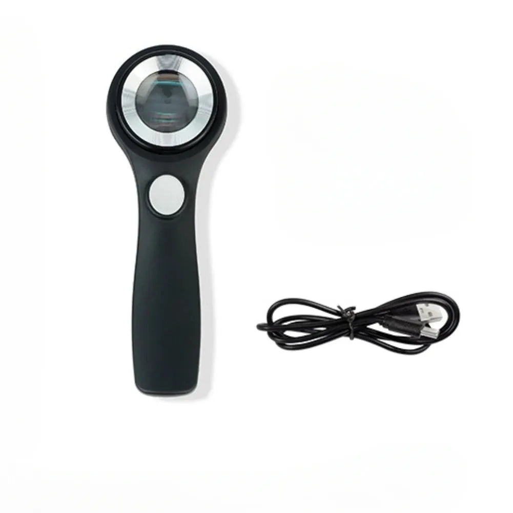 A black or silver appraisal magnifying glass with an optical glass lens and a USB-C charging cable.