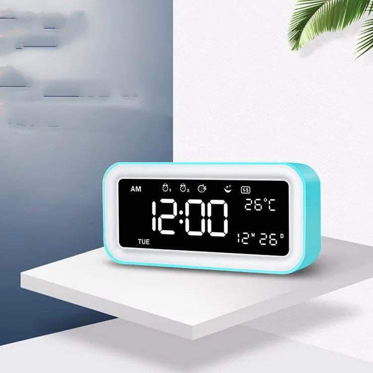 Blue rectangular LED atmosphere light alarm clock with digital display on wooden surface