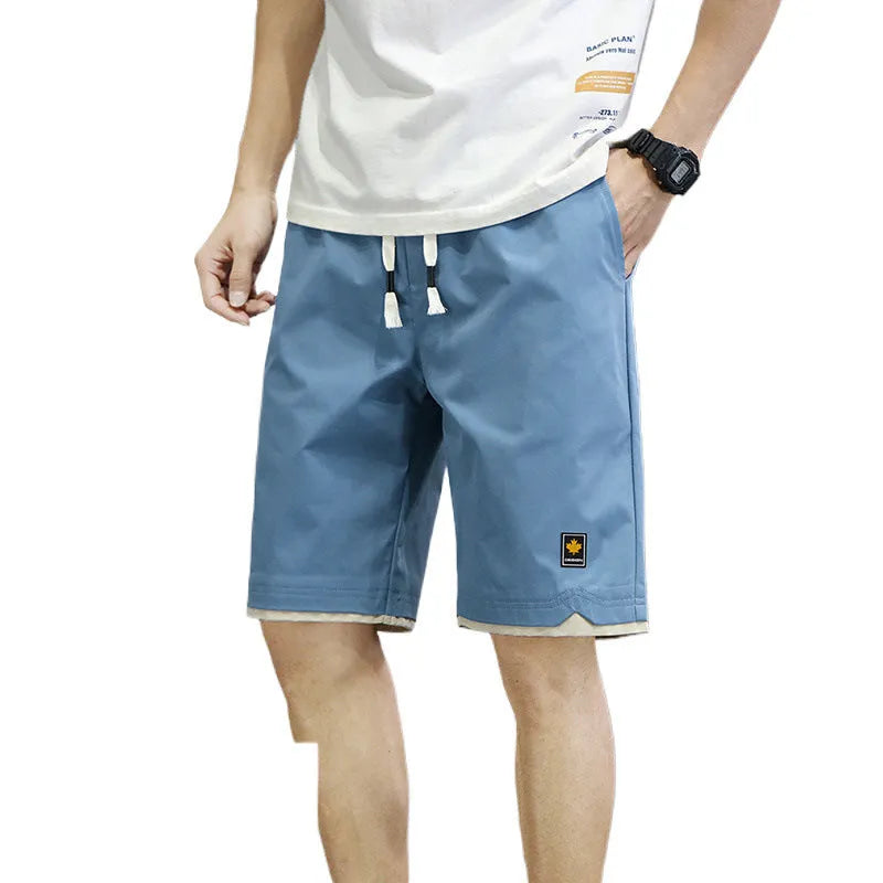 Men's loose-fit straight-leg casual beach shorts in polyester, shown in green.