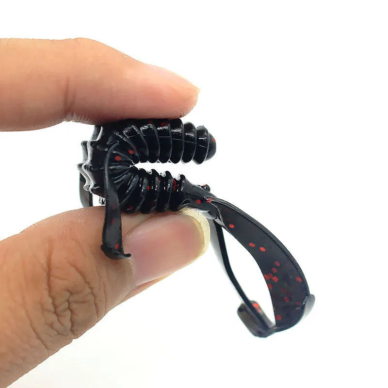 8cm PVC fishing soft bait lure in multiple colour variations against fishing tackle background
