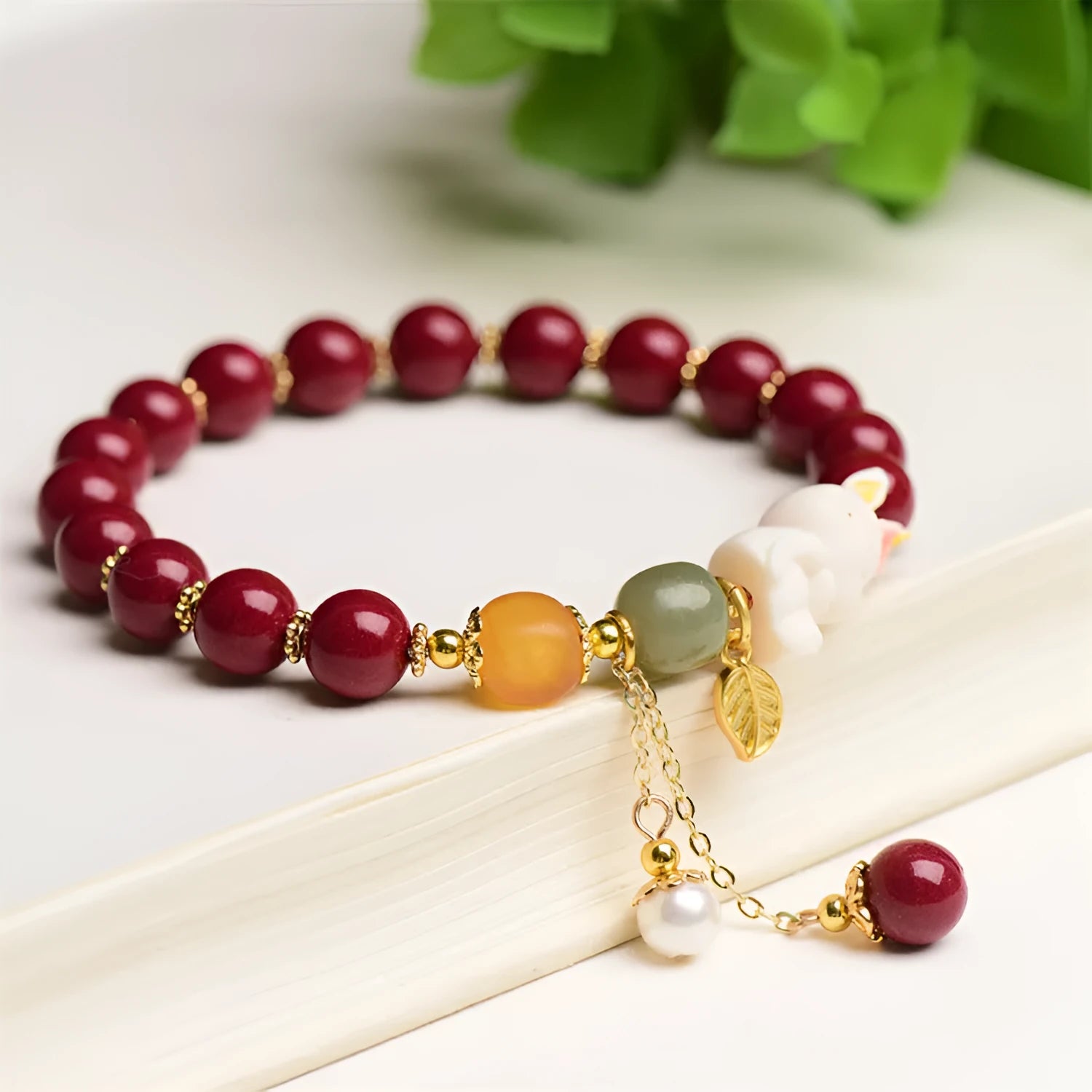 Natural cinnabar bracelet with rabbit motif in traditional Chinese design