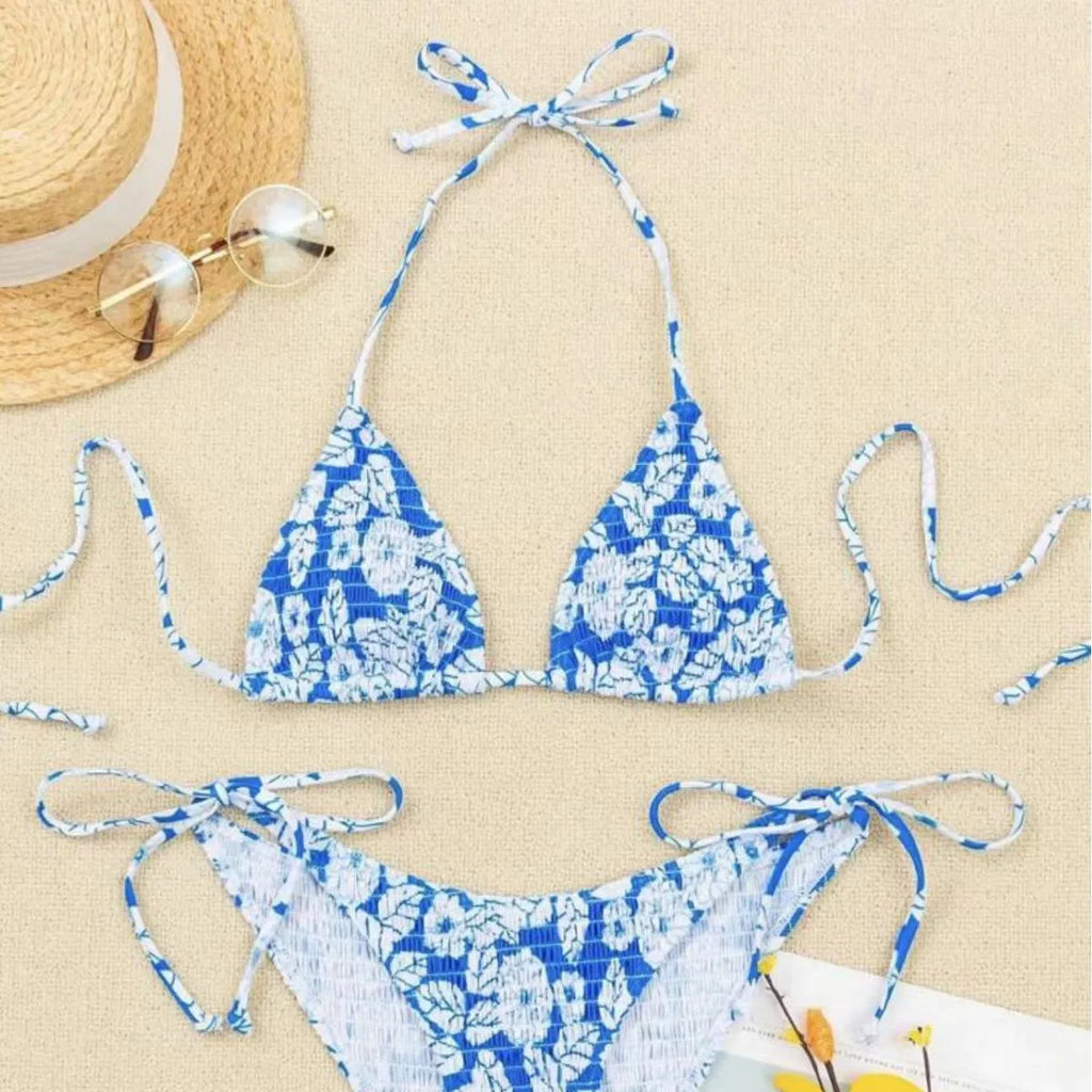 Women's floral halter neck swimsuit briefs in light blue on a mannequin