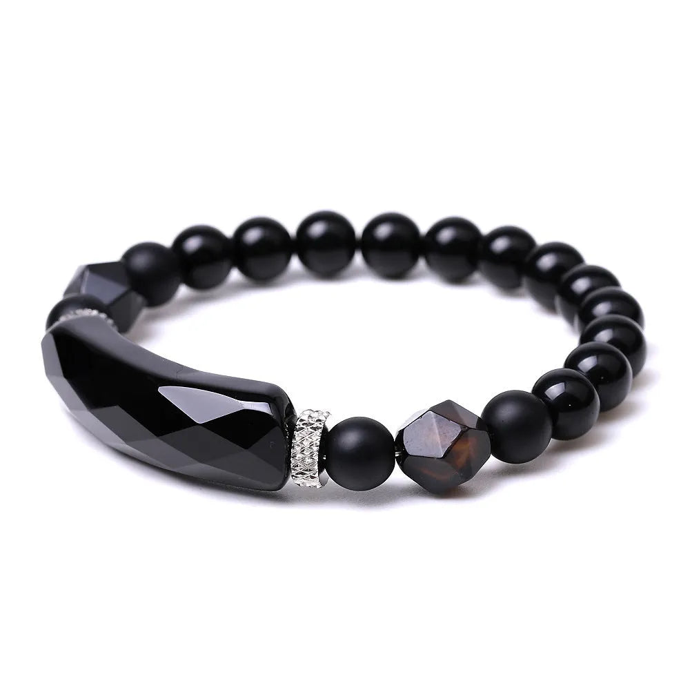 Handmade geometric bracelet with diamond-cut black agate beads and fan-shaped design elements.