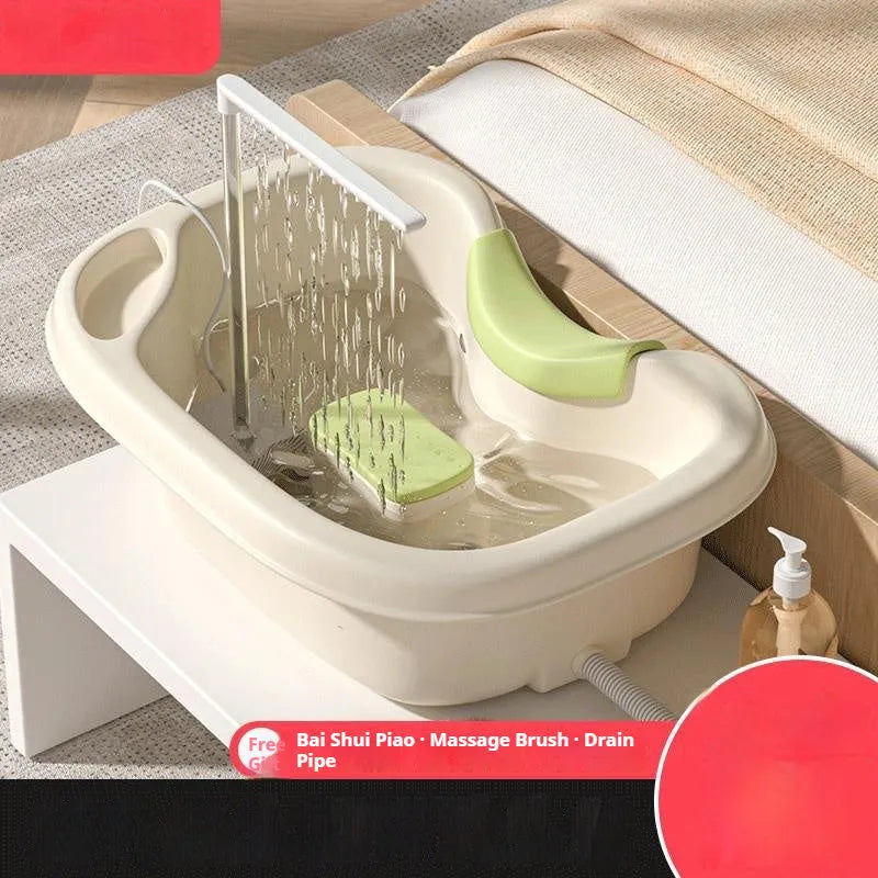 Portable plastic shampoo basin set with head pillow, water pump, hose, bailer, and brush for washing hair in bed