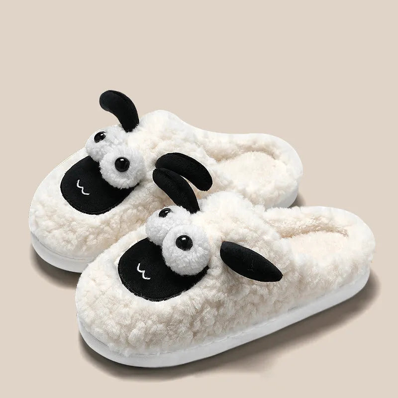 Brown thermal cotton slip-on slippers with suede upper and textured PVC sole on a wooden floor.